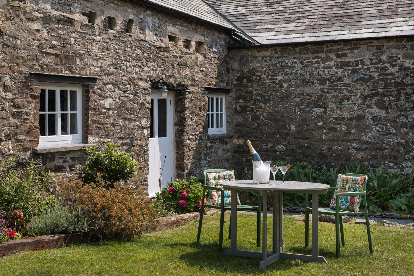 The North Wing with a bottle of champagne on the table in front of it