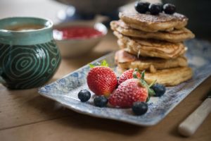 A delicious Cornish breakfast of pancakes and fruit
